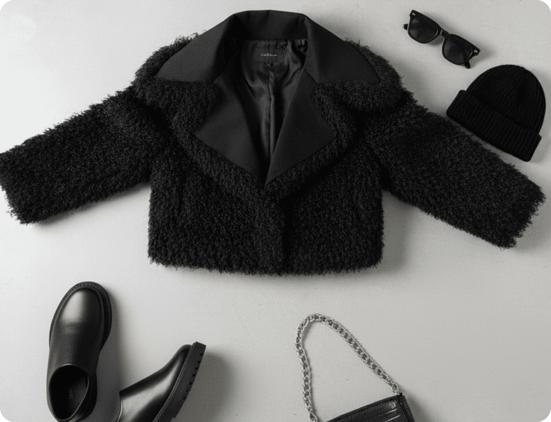 Black fur coat with accessories fashion flat lay